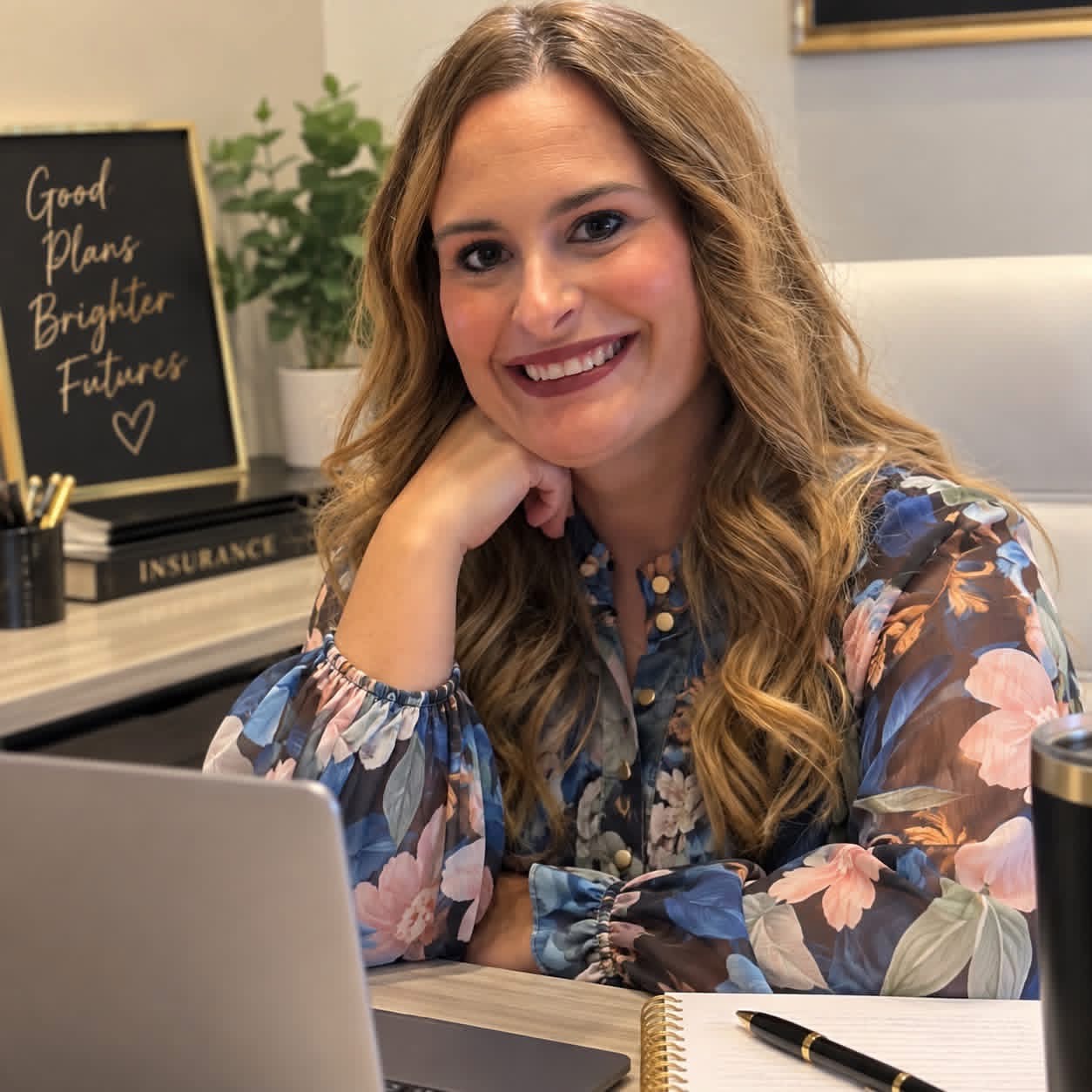 Mandy Serpas helping clients from her office